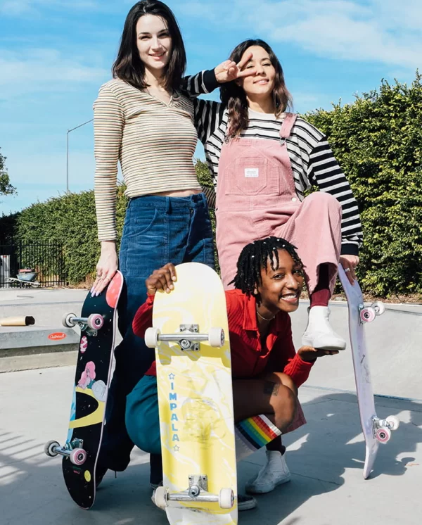 3 skateboarders with their Impala skateboards