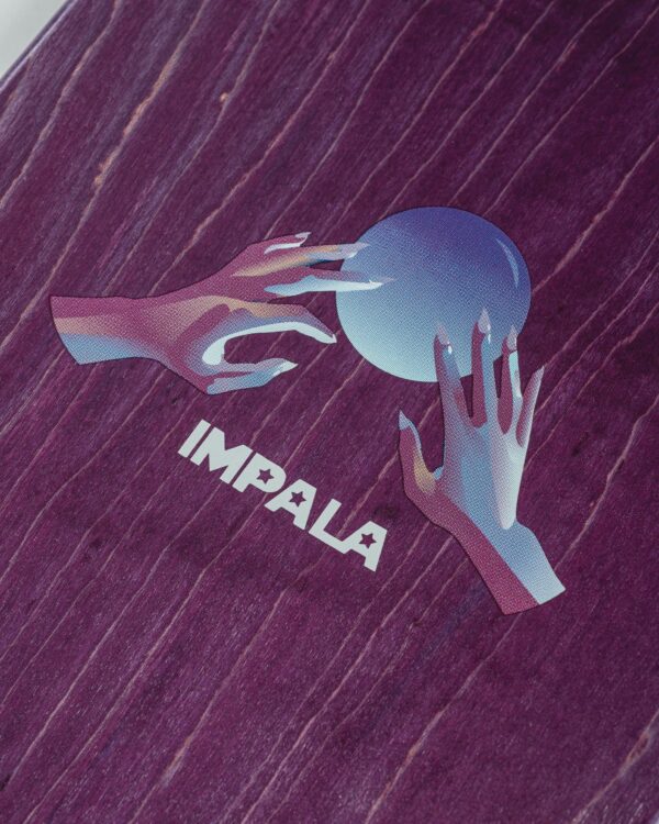 Close-up of the Impala Mystic Skateboard Deck's top graphic featuring vibrant hands and an orb in the middle
