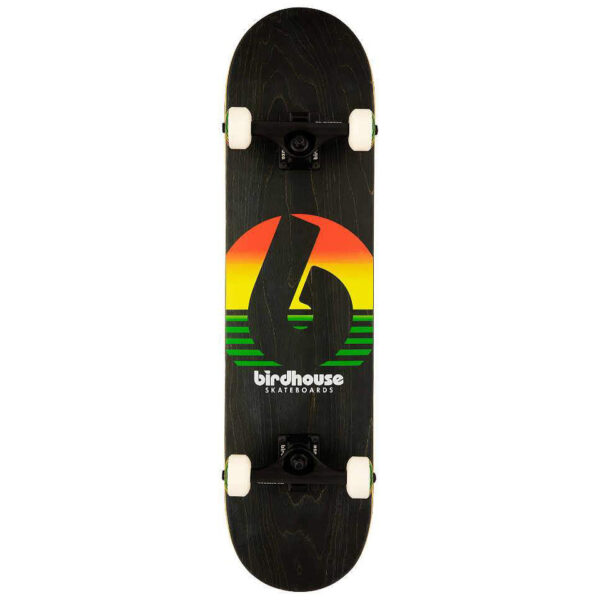 Birdhouse Sunset Rasta Complete Skateboard with black trucks, colorful sunset graphic, and white wheels with matching print.