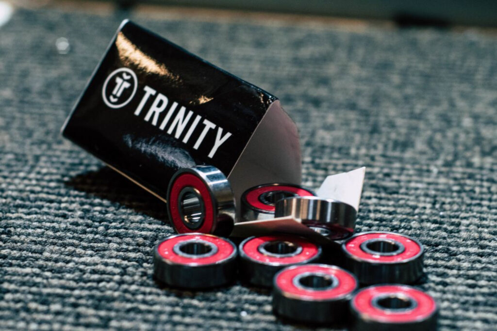 Image of red Trinity bearings with opened packaging