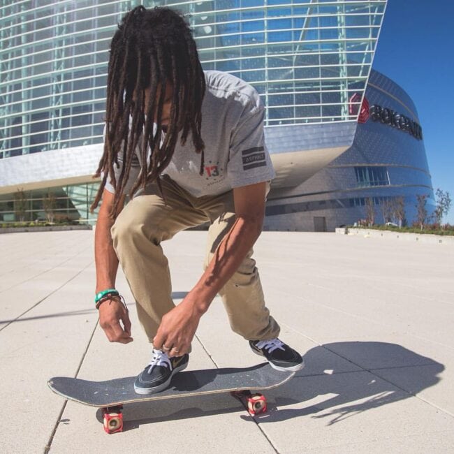 Skateboarder setting up for a kickflip on a board with Skater Trainers