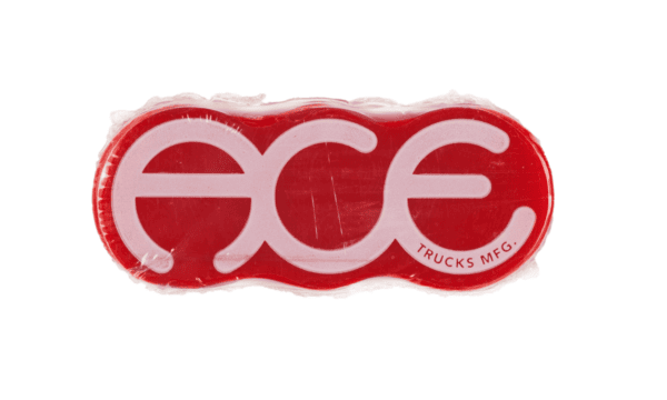 A detailed frontal view of the red wax block with the "ACE" logo and the text "Trucks MFG" in contrasting white font. The product is wrapped in shrink wrap.